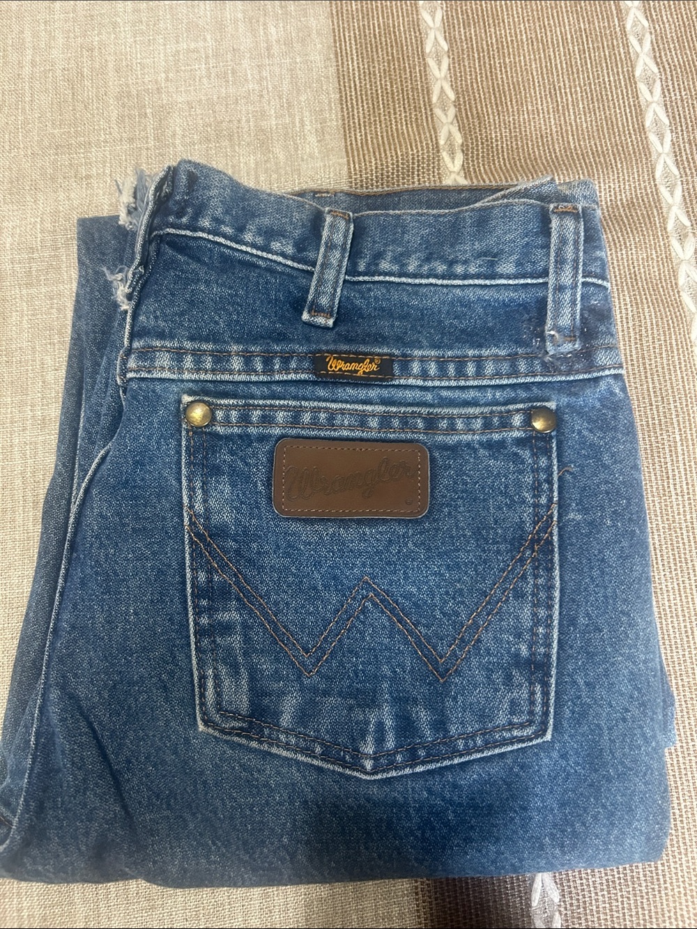 Wrangler Men’s Blue Denim Jeans with Brown Leather Patch